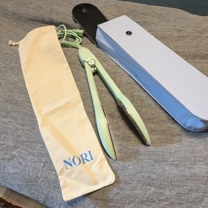 Nori hand held steamer iron. Only used twice.
